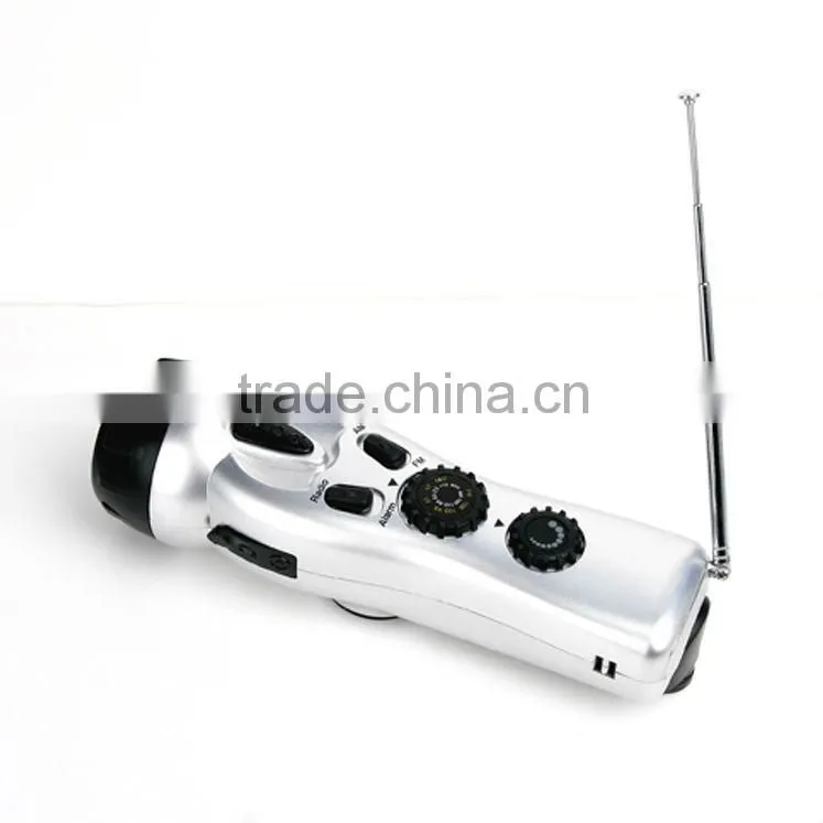 Dynamo Cranking Flashlight torch with Fm Radio, Sos Alarm, Mobile Phone Charger multi-use for home & outdoor