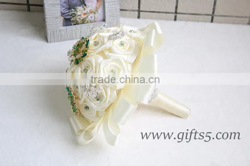 Romantic wedding bouquet full of crystal beads and green brooches