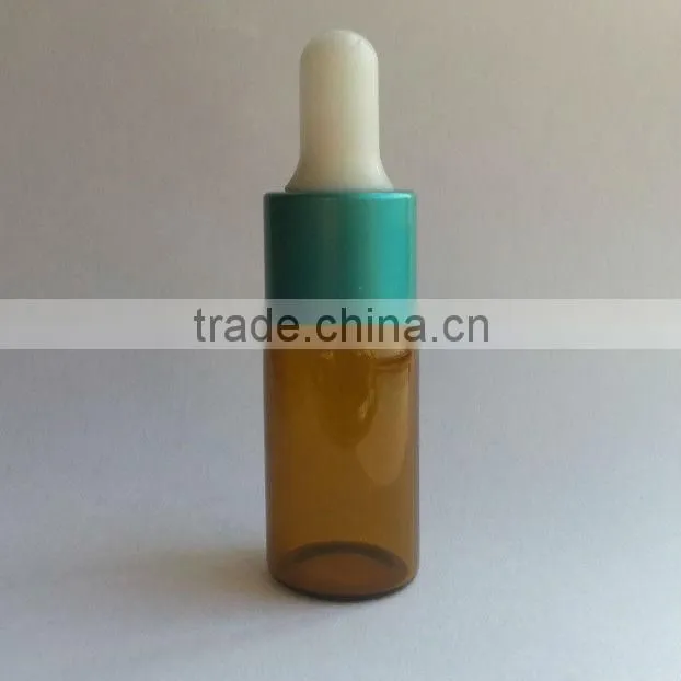 glass essential oil bottle with plastic cap and rubber dropper