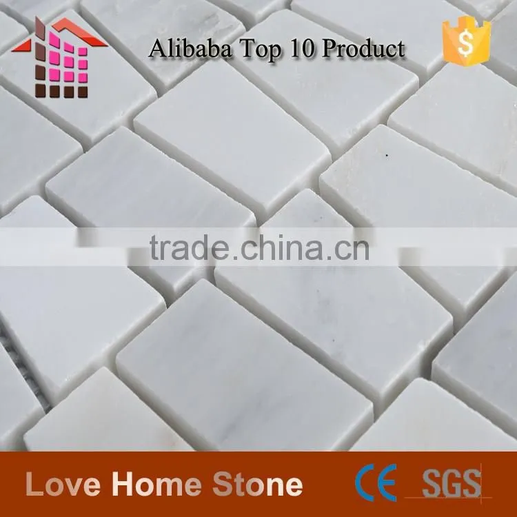 Carrara white mosaic tile, trapezoid tile backsplash