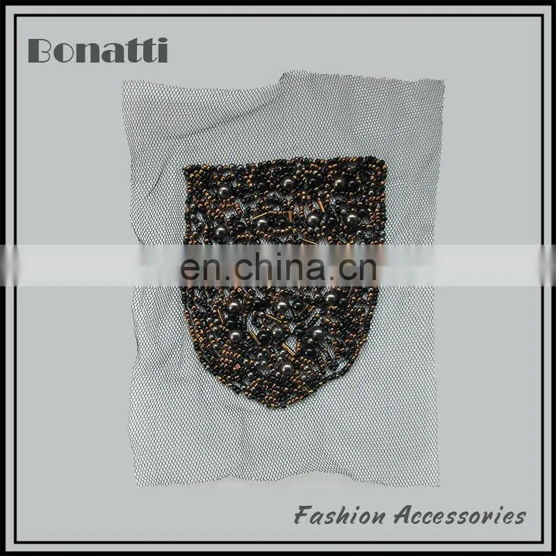 Hand-sewn bead neck trims