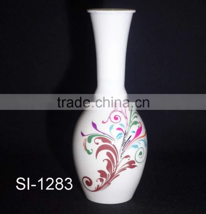 IRON VASE WITH LATEST DESIGN OF FLOWERS ON IT