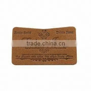 Custom & design embossed leather label for garment in dongguan