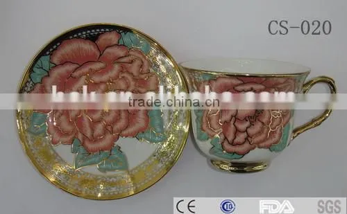 colored cafe tea cup and saucer