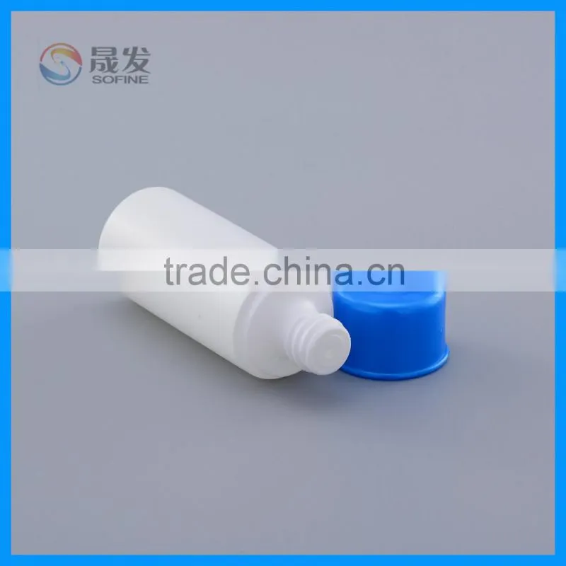 Empty small round plastic bottle