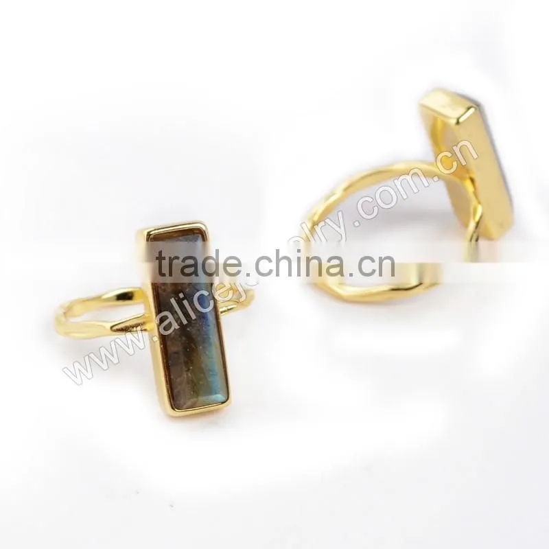 Natural faceted rectangle labradorite gemstone set into a 18k gold bezel ring