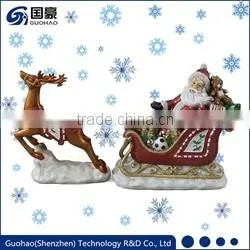 Regal Santa in sleigh with reindeer figurine