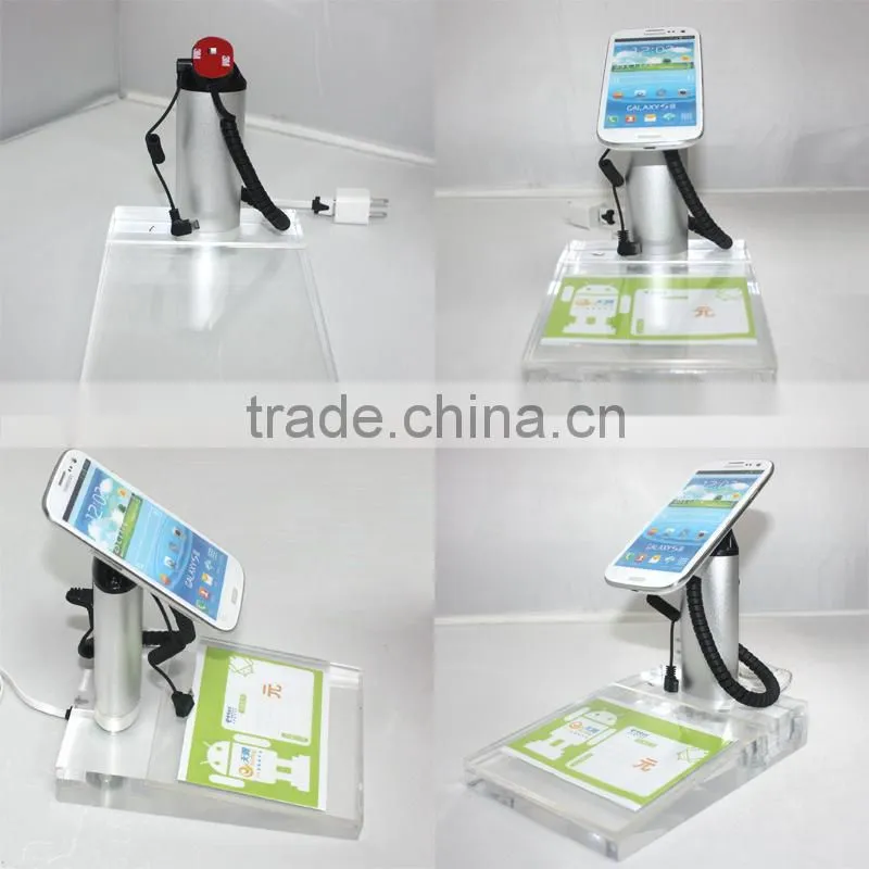 Alarm and charging of cell phone display holder