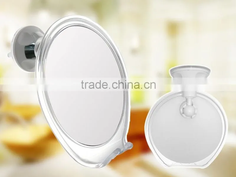 Fog free bathroom shaving mirror with a razor holder