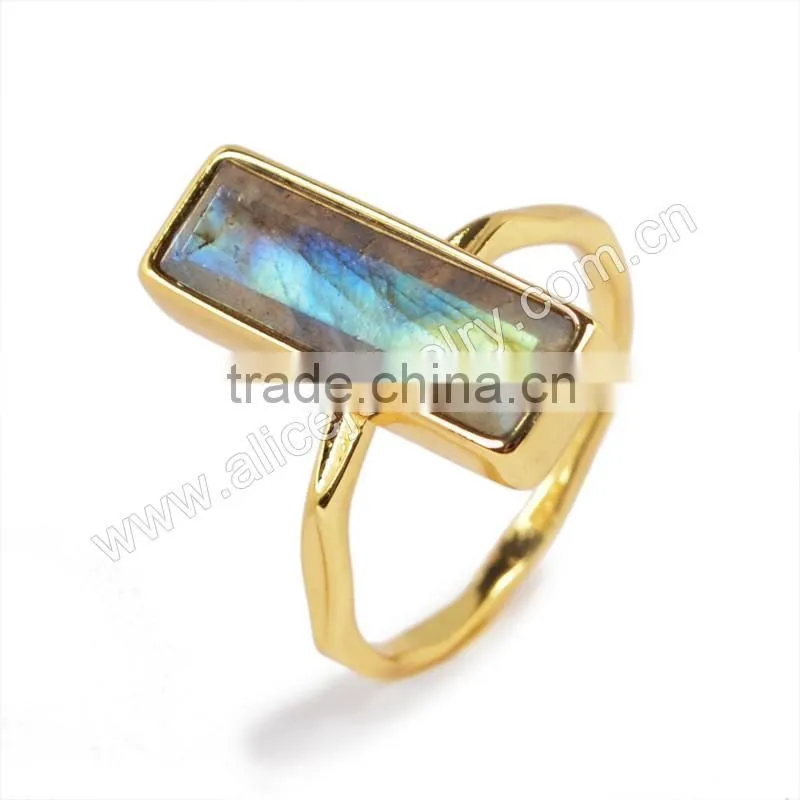 Natural faceted rectangle labradorite gemstone set into a 18k gold bezel ring