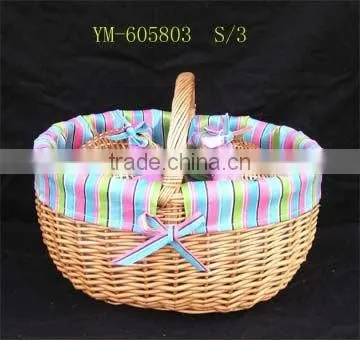 delicate wicker picnic basket with lid.