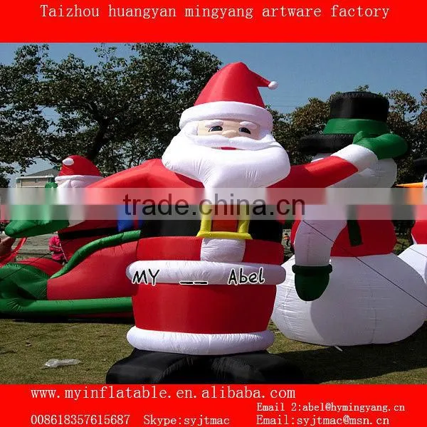 Christmas decorations santa and penguin by train