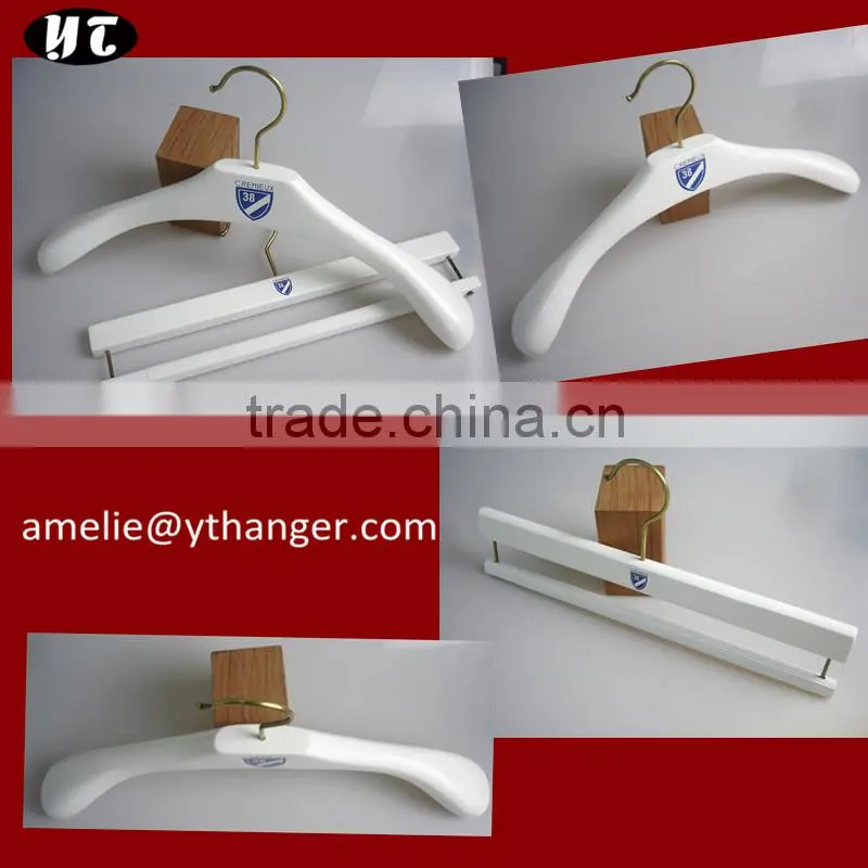white wooden coat hanger and pants hanger for shop store