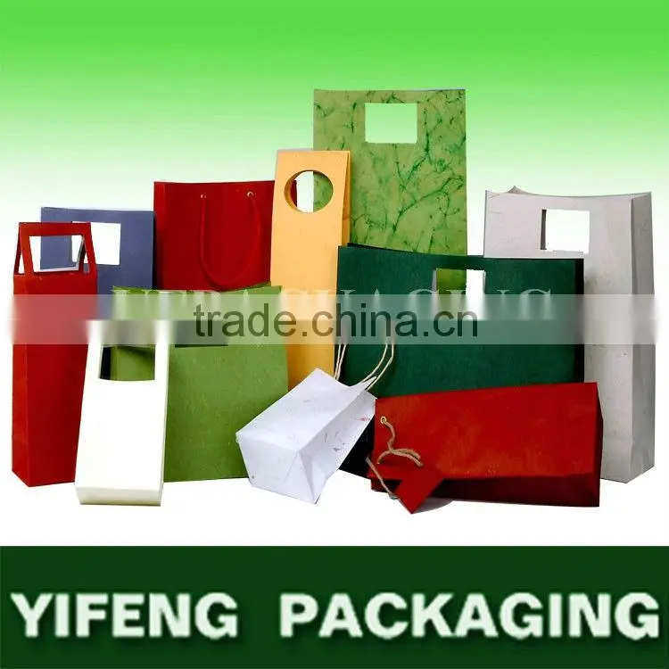 China Supplier customized popular wholesale paper carrying gift wine bottle bags