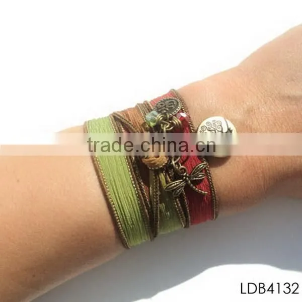 Fashion ribbon bracelet with gold plated dragonfly and tree china supplier