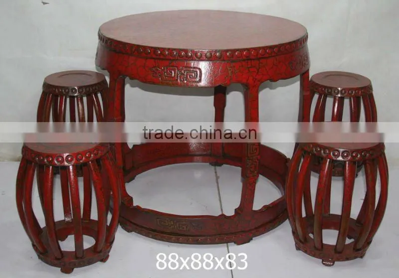 red wooden flower stool