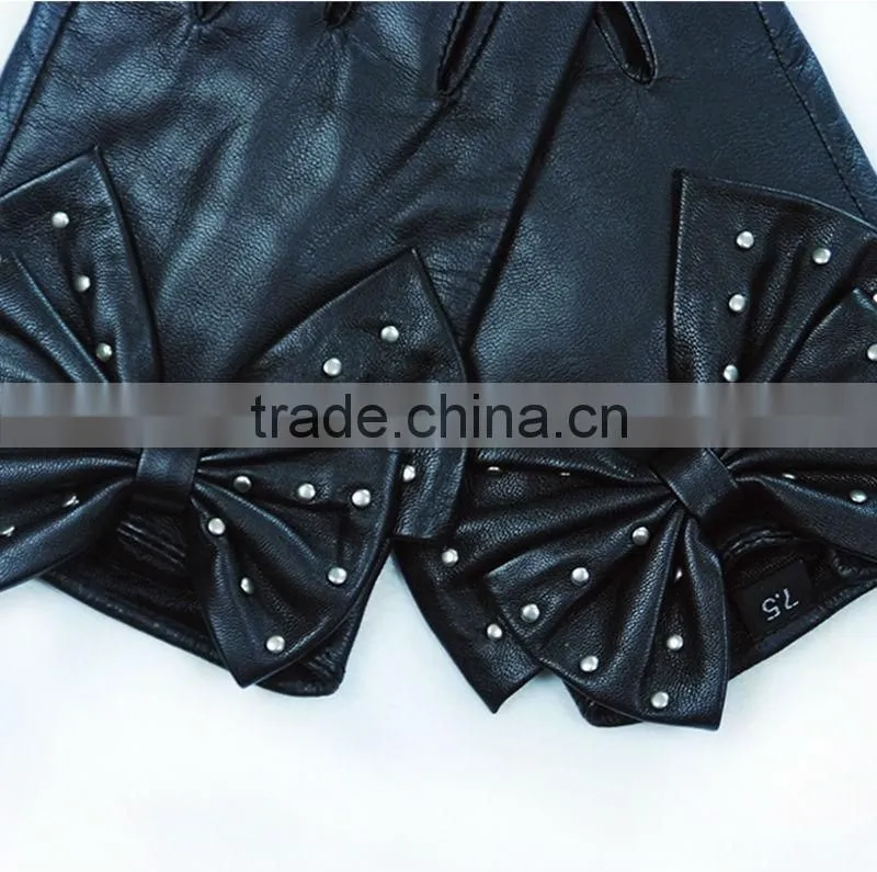 stylish black studded gloves in a big bow