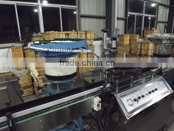 aerosol actuator fitting machine