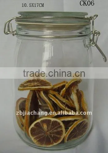 Clear glass food storage bottle with metal clip