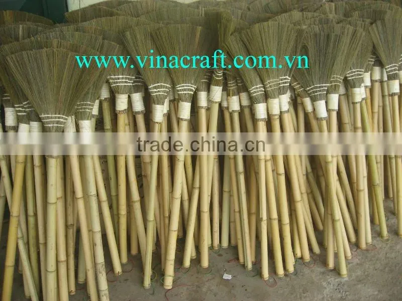 Small grass broom with plastic twist on handle