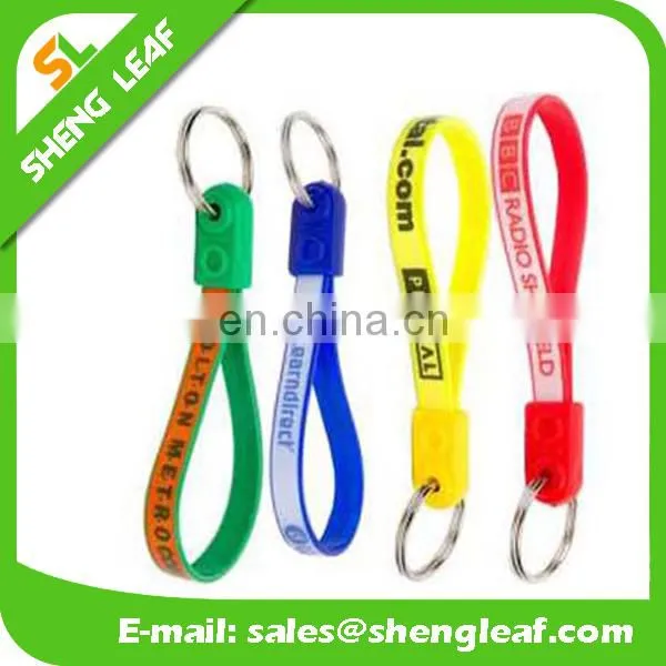 Hot sale silicone rubber bracelet key ring , 100% silicone wristband key chain , screen printing silicone keychain