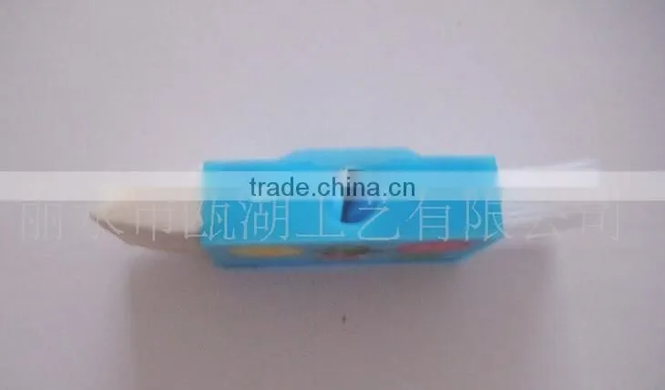 Plastic sharpener with eraser and brush