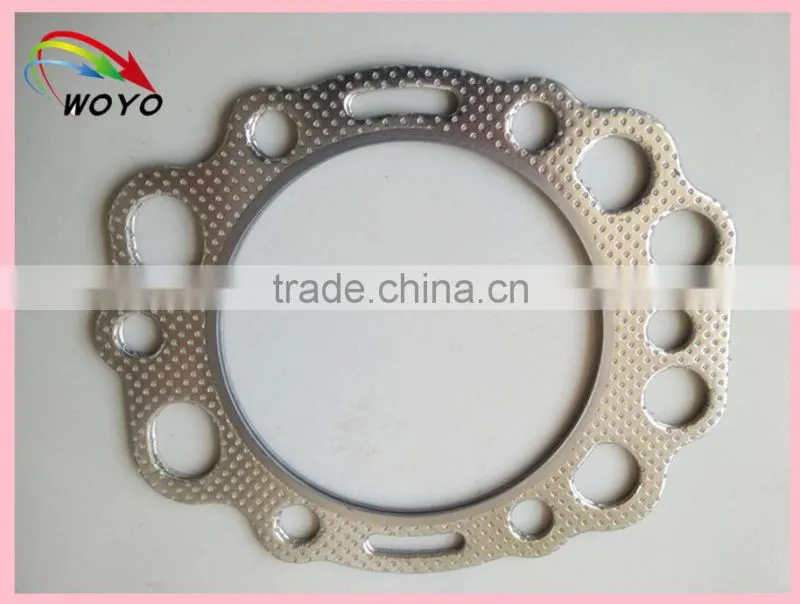 Reinforced graphite sheet with tanged metal for cylinder head gasket