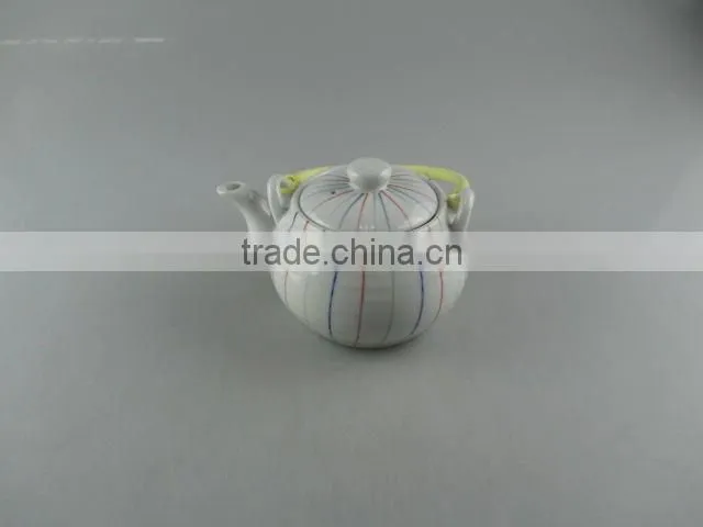 Stocked round ceramic tea pot with flexible handle
