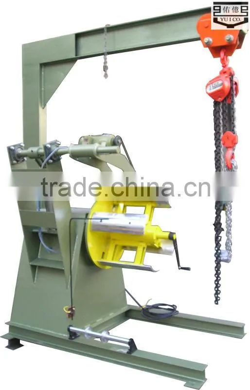 hydraulic rewinder with hold down arms crane