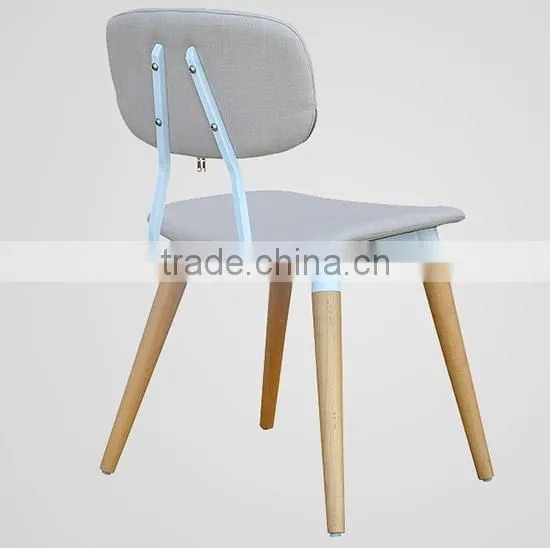 blue fabric upholstered dining room chair with leather