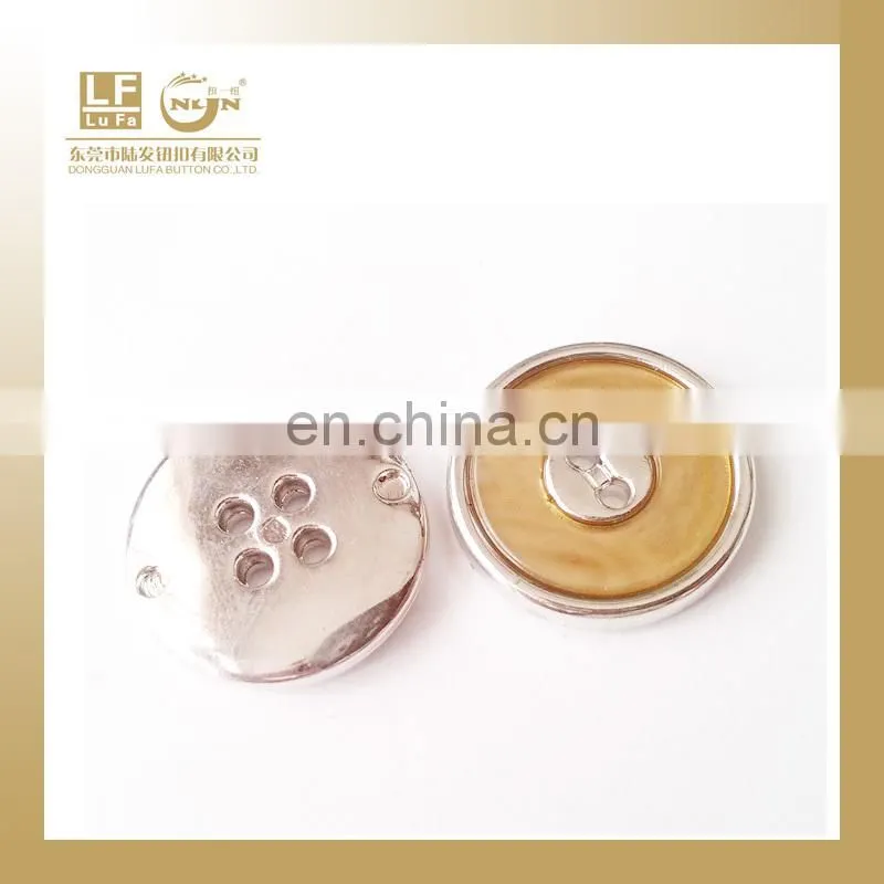 plastic button with metal rim