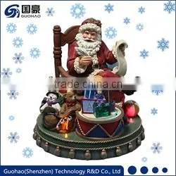Regal Santa statue and Sledding Santa Figurine