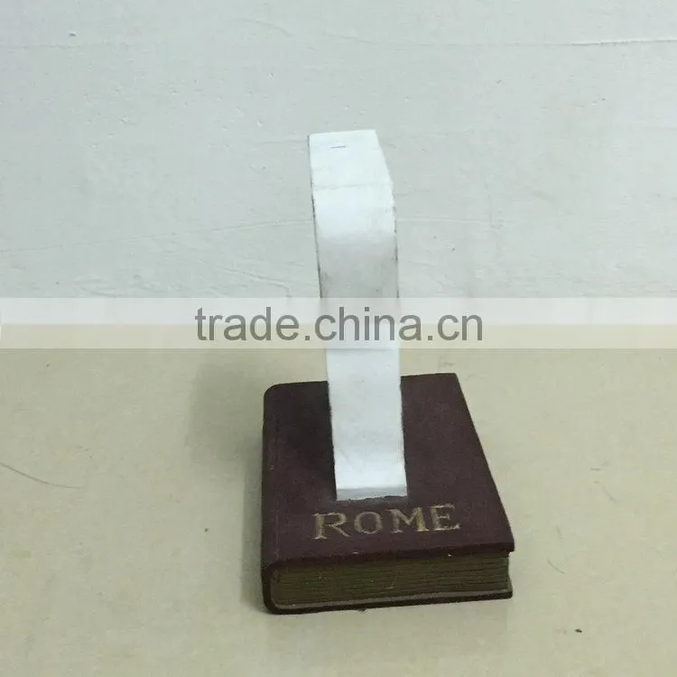 Polyresin book with letter statue