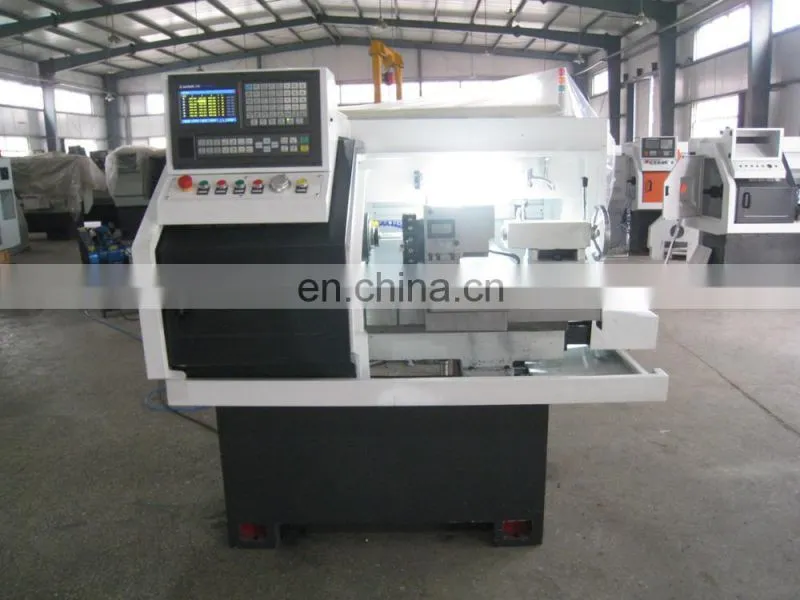 The small cnc lathe machine with chuck and tool turret CK0640A