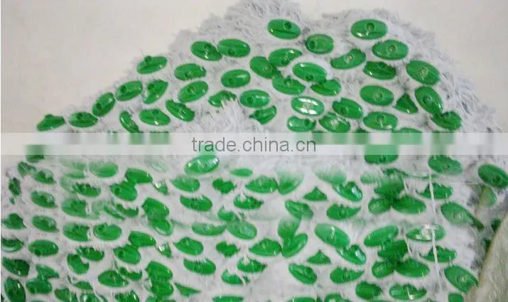 white cotton mop head with green plastic socket