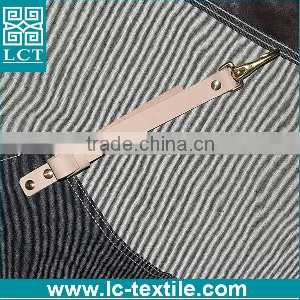 black denim apron with leather straps