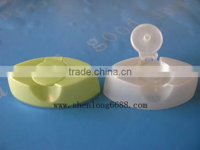 Plastic flip top cap for shampoo bottles