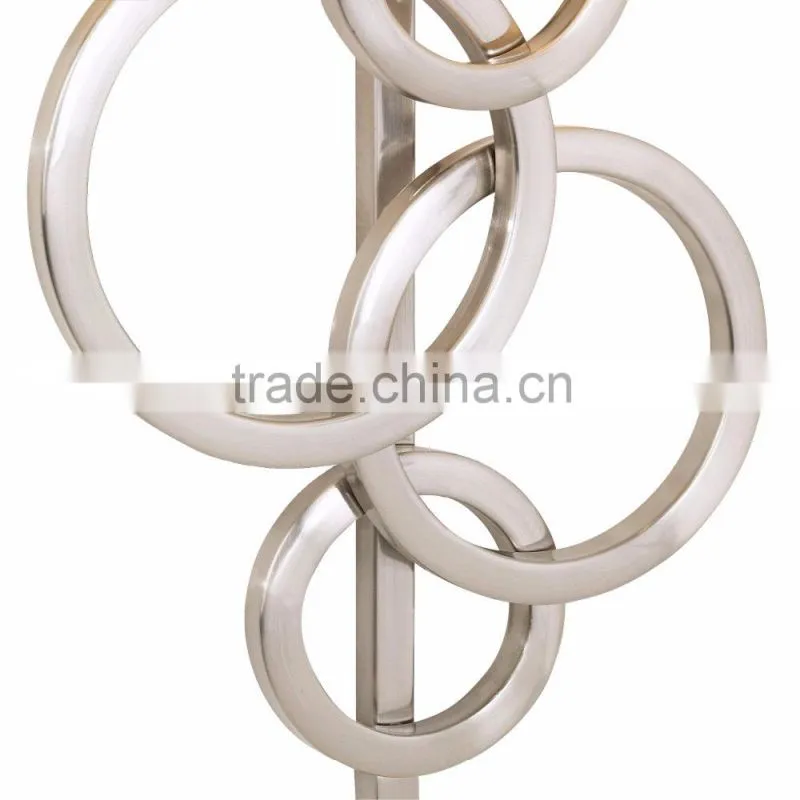 1017-1 sleek brushed steel finish raindrops falling on a calm body of water intertwining Circles Plug-In Wall Sconce