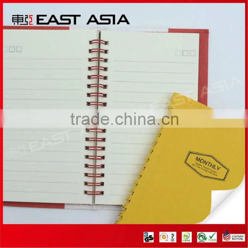 red specialty paper cover notebook with spiral binding