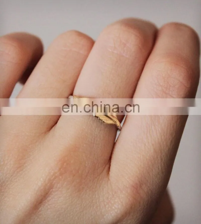Custom gold and silver nautical feather rings