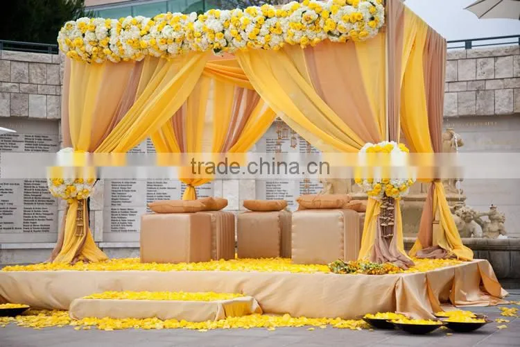 fancy and elegant pipe and drape wedding backdrop