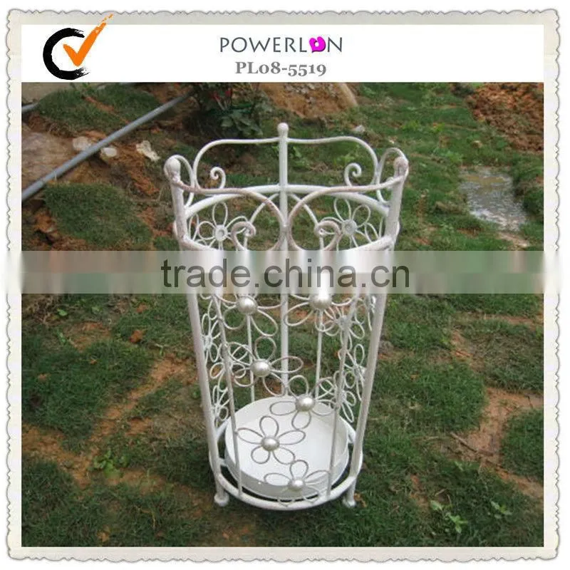 Antique metal basket beach umbrella holder