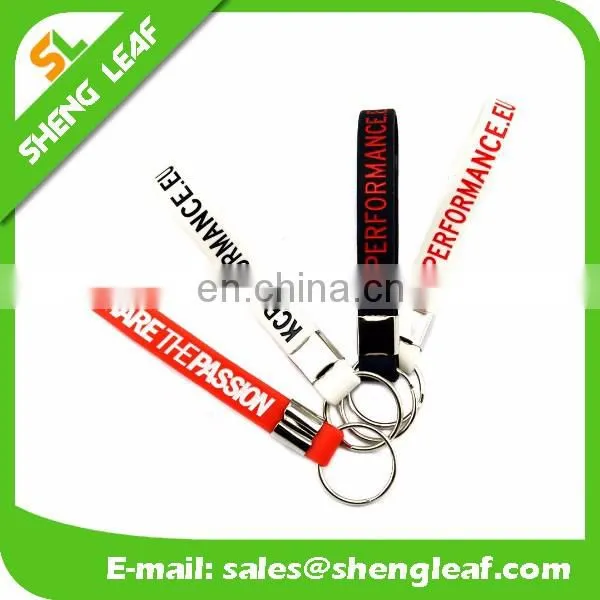 Hot sale silicone rubber bracelet key ring , 100% silicone wristband key chain , screen printing silicone keychain
