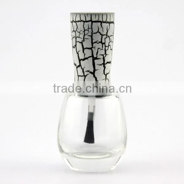 round glass bottle with nail polish cap and brush empty nail polish bottle