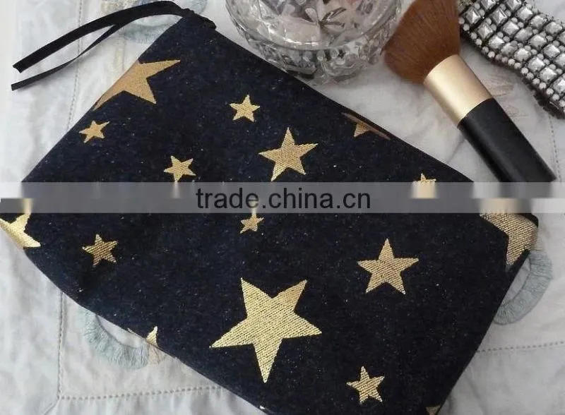 Beautiful zip cosmetic bag made from denim fabric with metallic gold star print