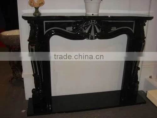 yellow scupltured stone fireplace surround