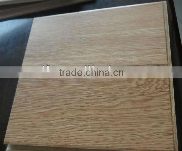 Hand grasps laminated floor