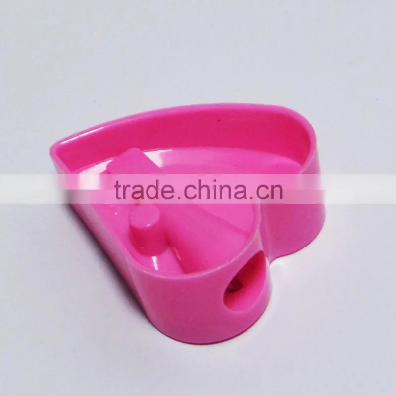 One hole plastic novelty heart shaped pencil sharpener