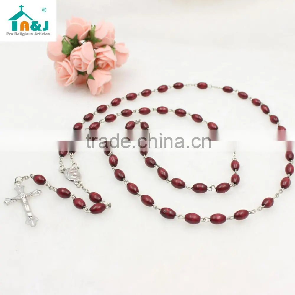 Dark brown oval wooden bead Jesus rosary