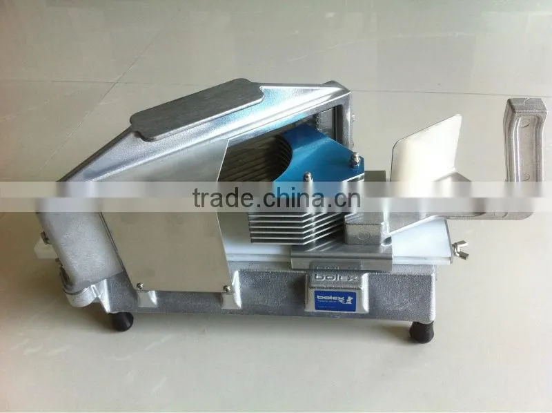 Hand operated tomato slicer